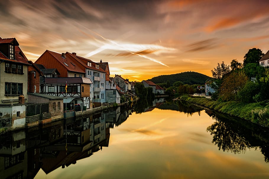 Village Near Body of Water, architecture, bright, clouds, dawn HD wallpaper