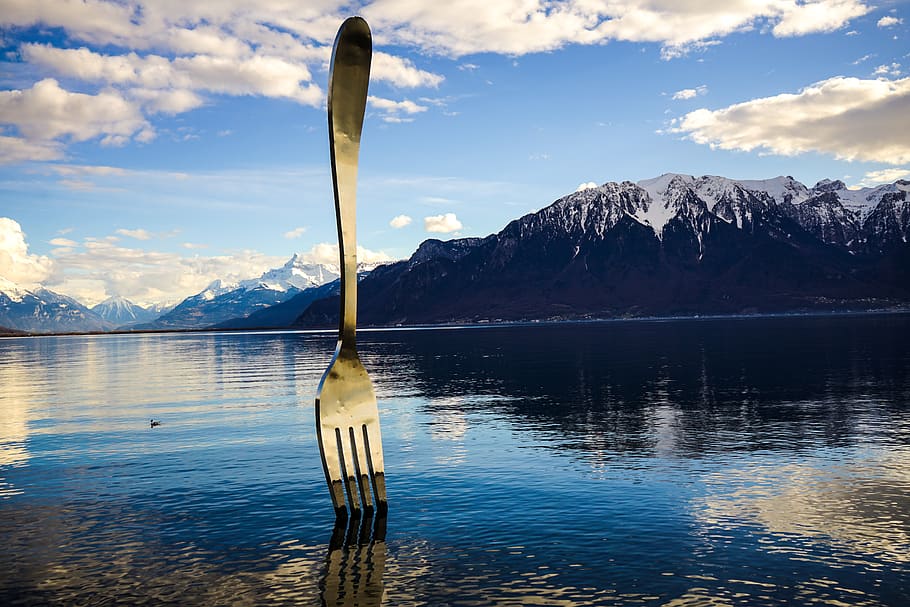 Gray Stainless Steel Fork on Water With Overlooking Mountain at Daytime HD wallpaper
