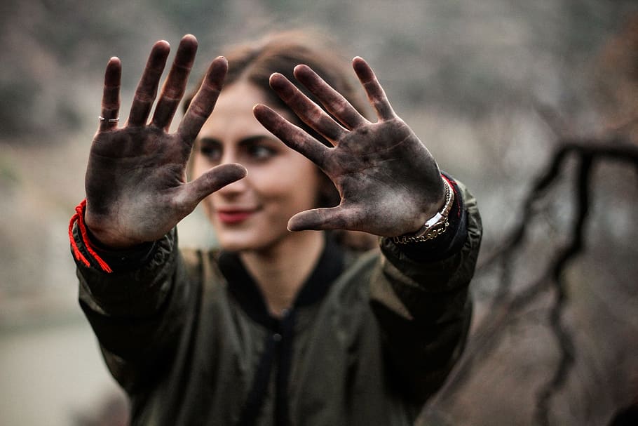 woman showing her hands with black paint, female, dirty, hands up
