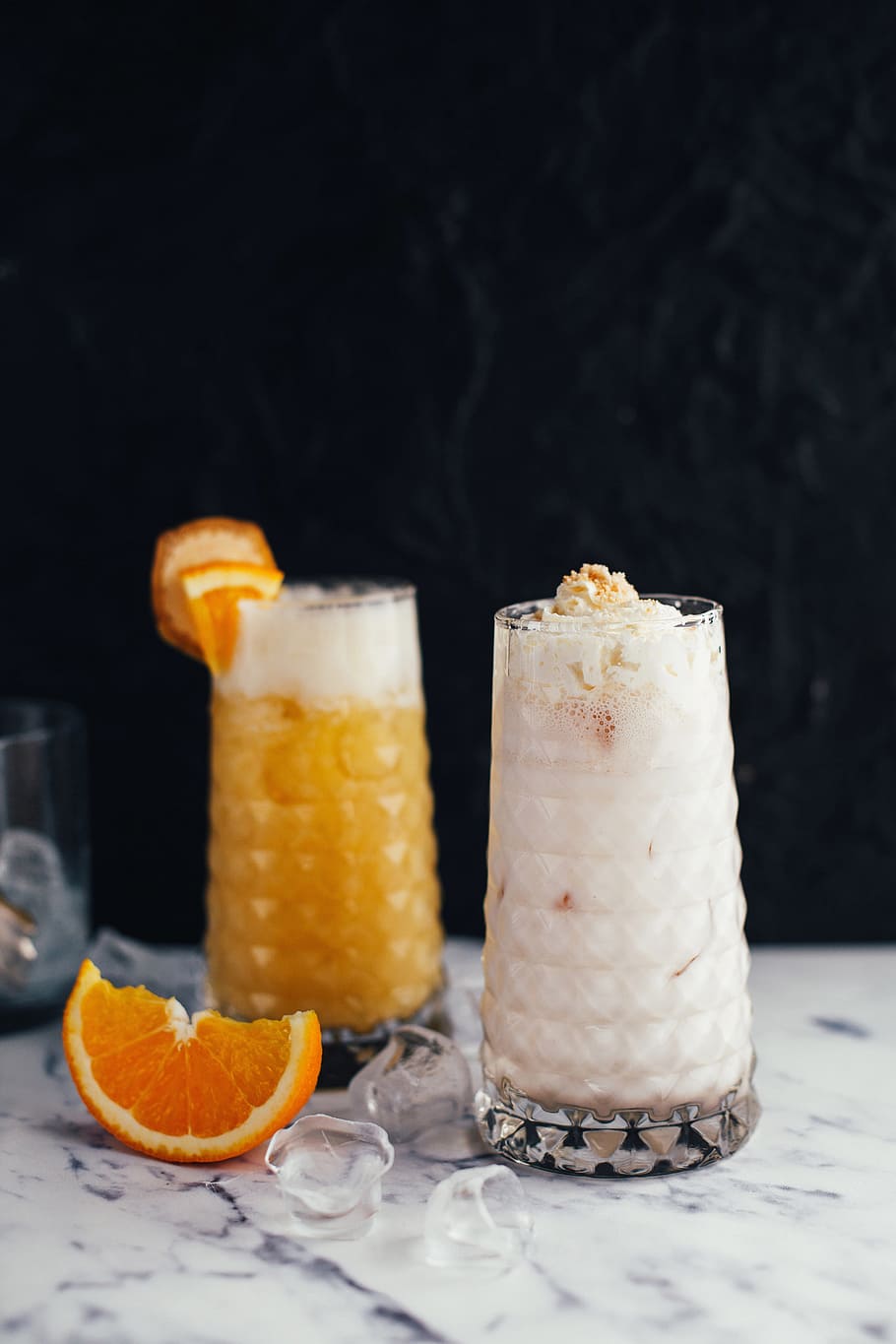 two clear drinking glasses with juice on table, orange, slice HD wallpaper