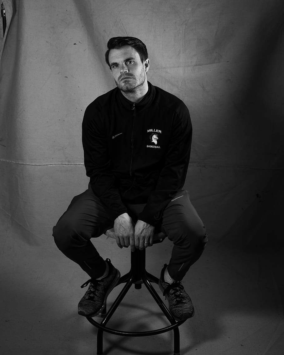 man sitting on black stool, one person, front view, lifestyles HD wallpaper