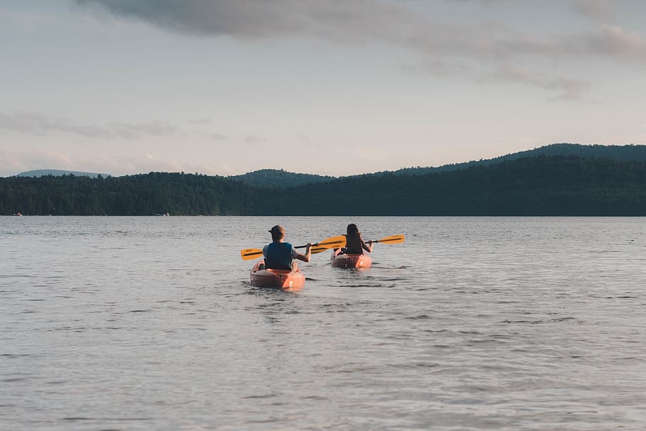 man and woman riding kayaks paddling on calm body of water, person, HD wallpaper