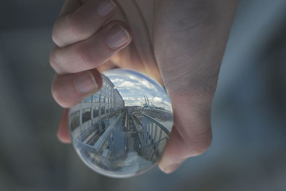 Person Holding Clear Glass Decor, ball, ball-shaped, blur, conceptual HD wallpaper