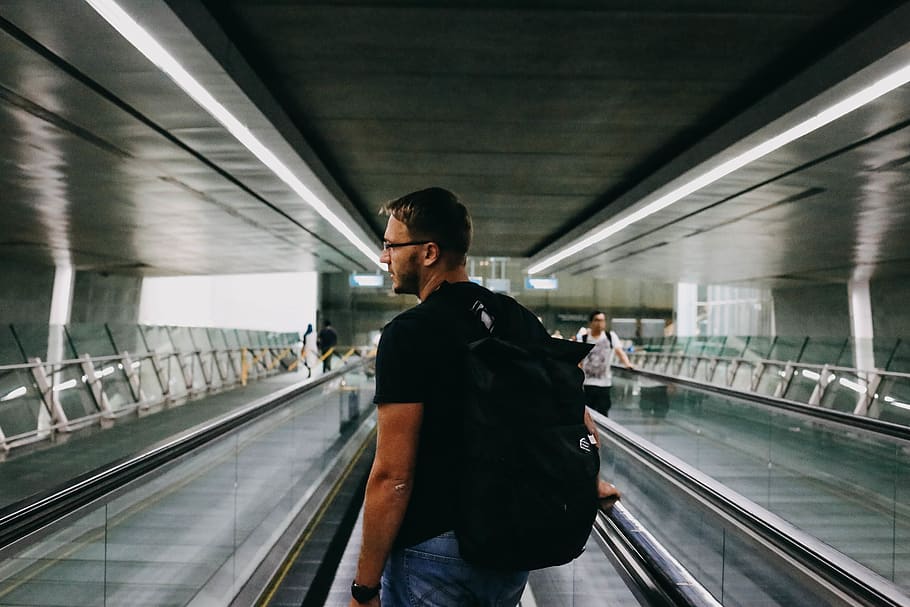 man wearing black backpack, person, human, people, vehicle, train HD wallpaper