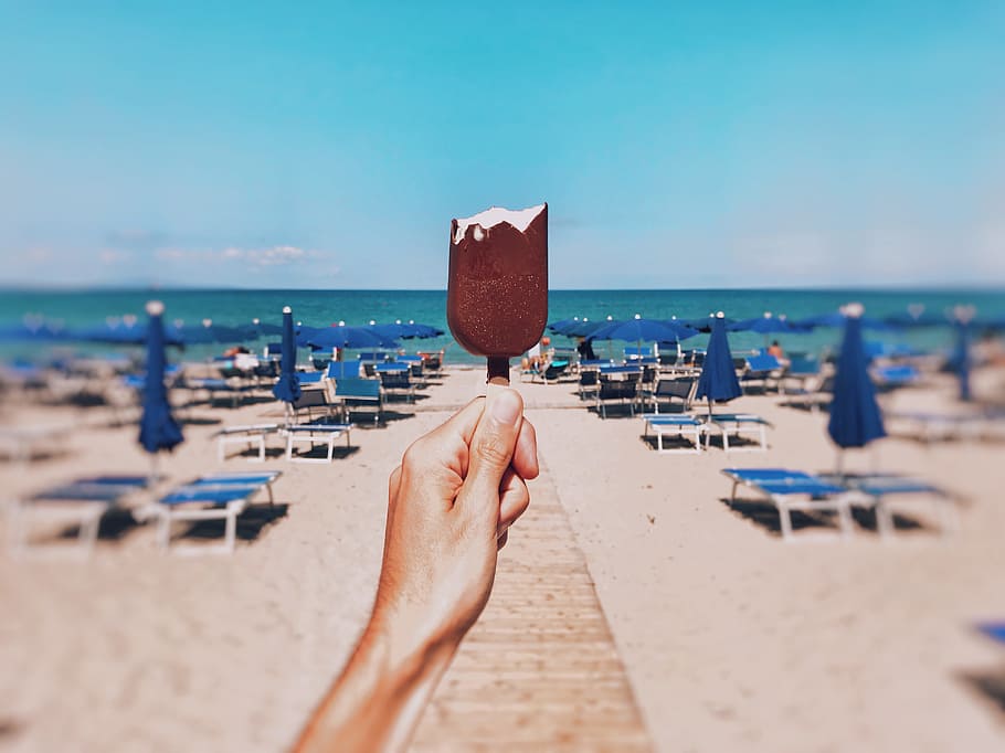 Person Holding Icecream, beach, dessert, hand, ice cream, outdoors, HD wallpaper