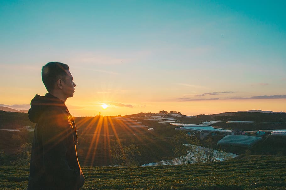 Photo of Man During Sunrise, dawn, daylight, dusk, grass, hoodie HD wallpaper