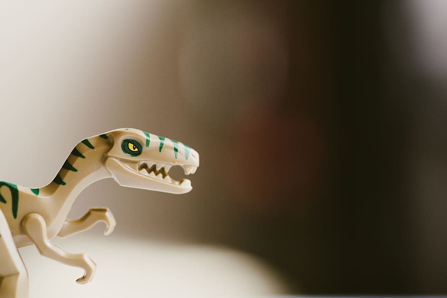 A toy dinosaur., macro, lego, minifig, raptor, animal representation HD wallpaper