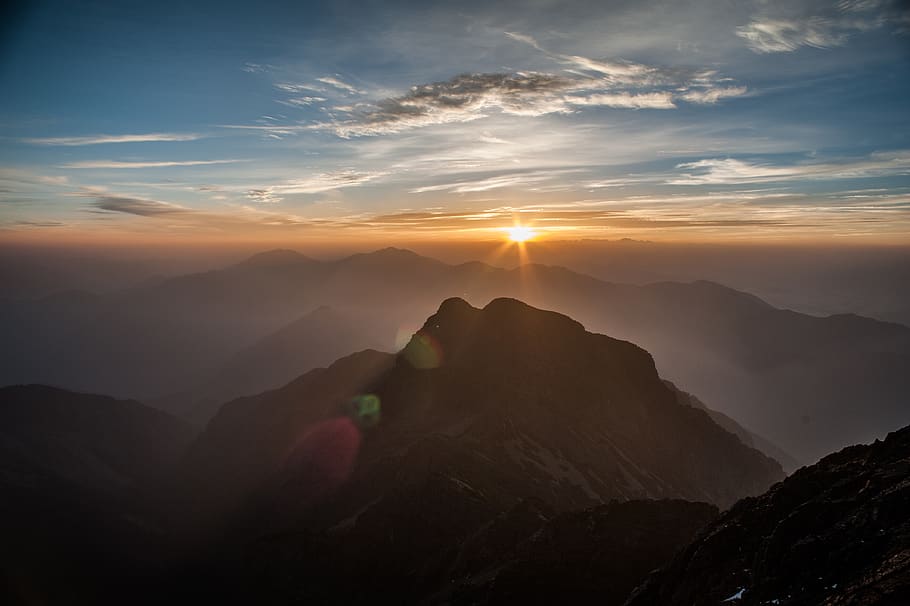 high-angle photography of mountain, flare, light, nature, outdoors