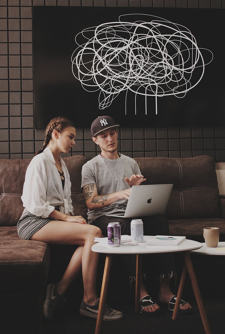 man and woman sitting on sofa using MacBook, real people, young adult HD wallpaper
