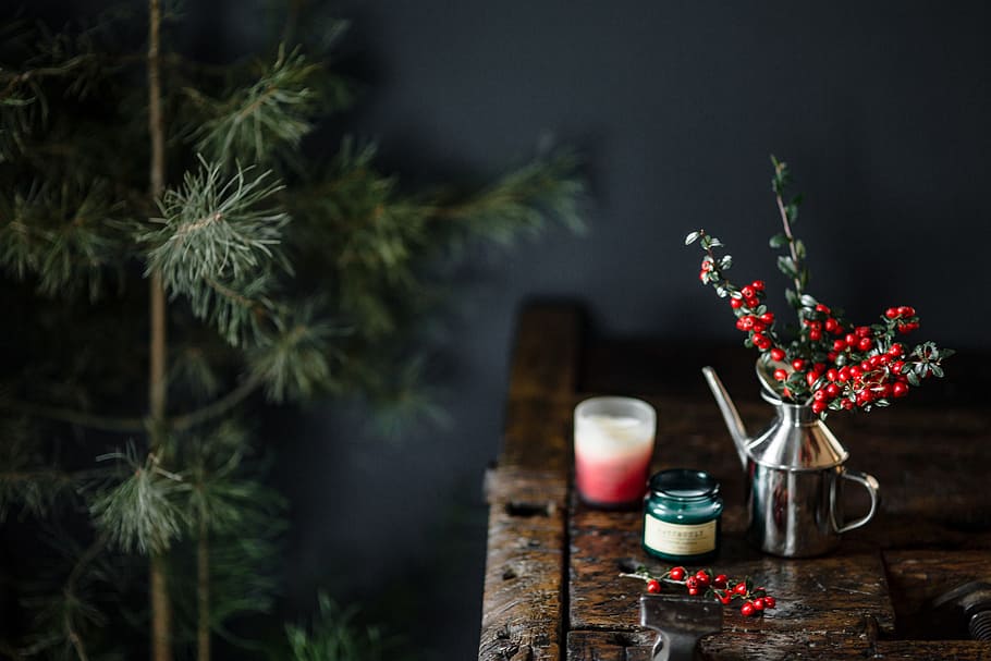 Fresh Holly and Candles, wooden desk, old wood, fresh coconut