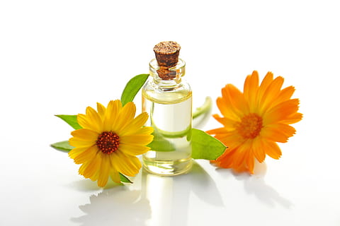 Two Yellow Sunflowers With Clear Glass Bottle With Cork Lid, aromatherapy HD wallpaper