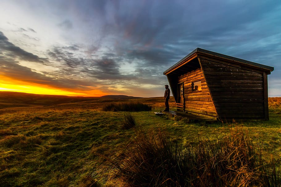 Man Standing Beside Brown House, barn, clouds, colorful, colors HD wallpaper