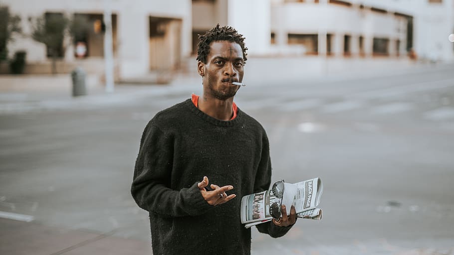 standing man holding newspaper, human, person, apparel, clothing HD wallpaper