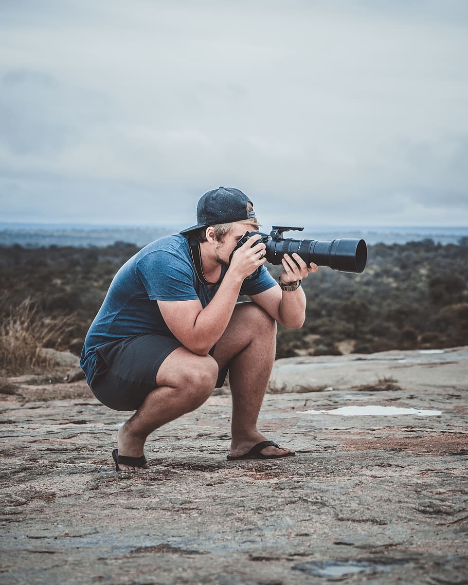 Man Taking Photo Using Black Dslr Camera, camera lens, cap, daylight HD wallpaper