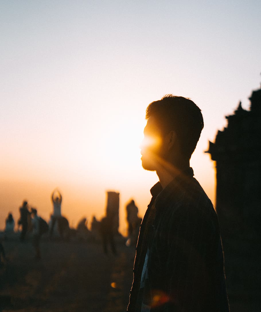 HD wallpaper: Man Standing Near People, backlit, blurred background, golden  hour | Wallpaper Flare