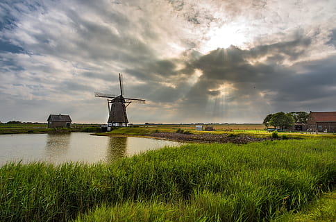 Gray Windmill Near Body of Water, barn, clouds, cropland, daylight HD wallpaper