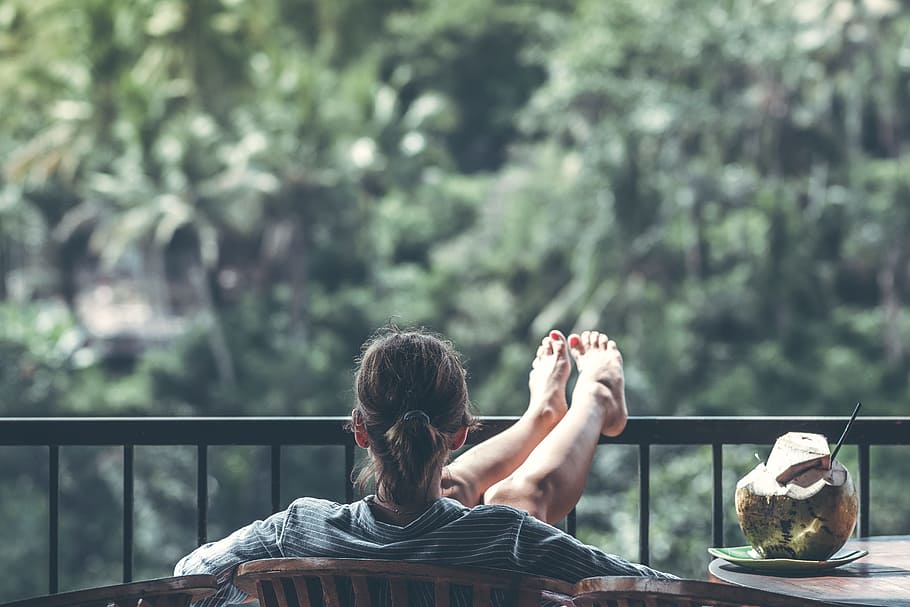 person sitting on chair in front of tree, seat, railing, table HD wallpaper