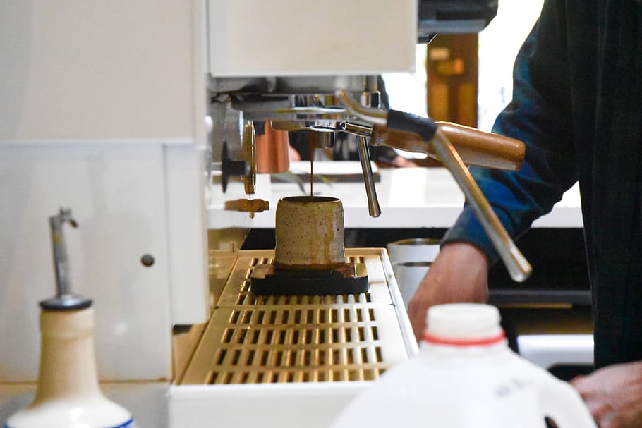 man preparing coffee from coffee machine, human, person, building HD wallpaper