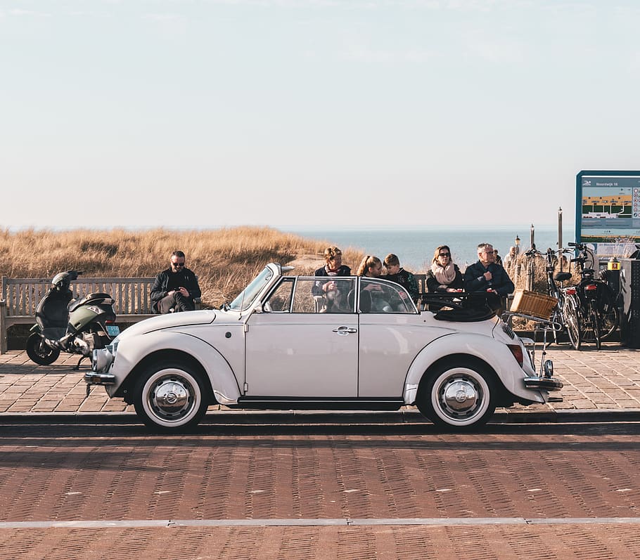 white Volkswagen Beetle on road, human, person, automobile, car HD wallpaper