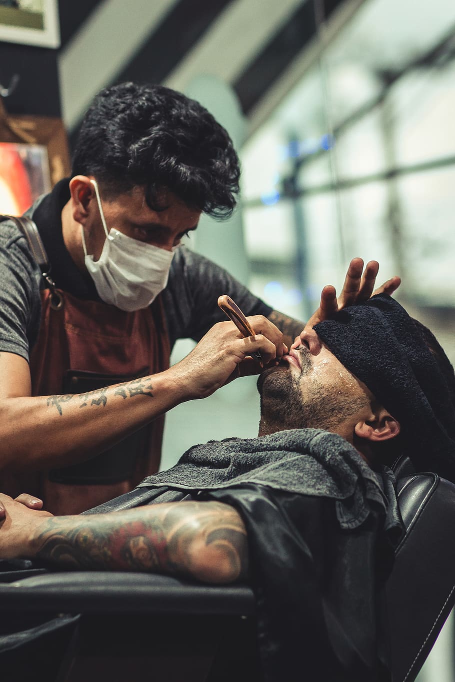 Man Shaving Man's Beard Using Straight Razor, barber, barbershop