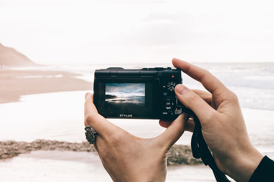 Person Taking Picture of Sea Using Point-and-shoot Camera, beach HD wallpaper