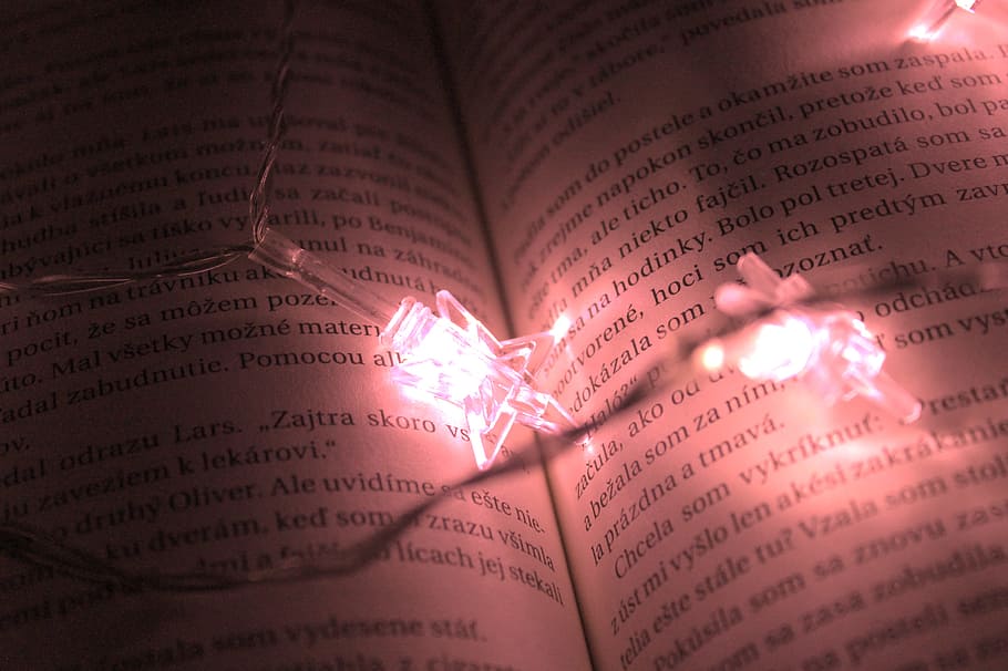 Star Shaped Lights On A Book, dark, illuminated, paper, string lights HD wallpaper