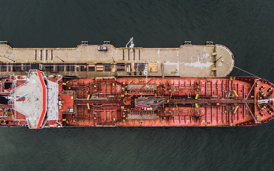 Aerial view of forward part of the hull of a ship docked at the port surrounded with sea water HD wallpaper