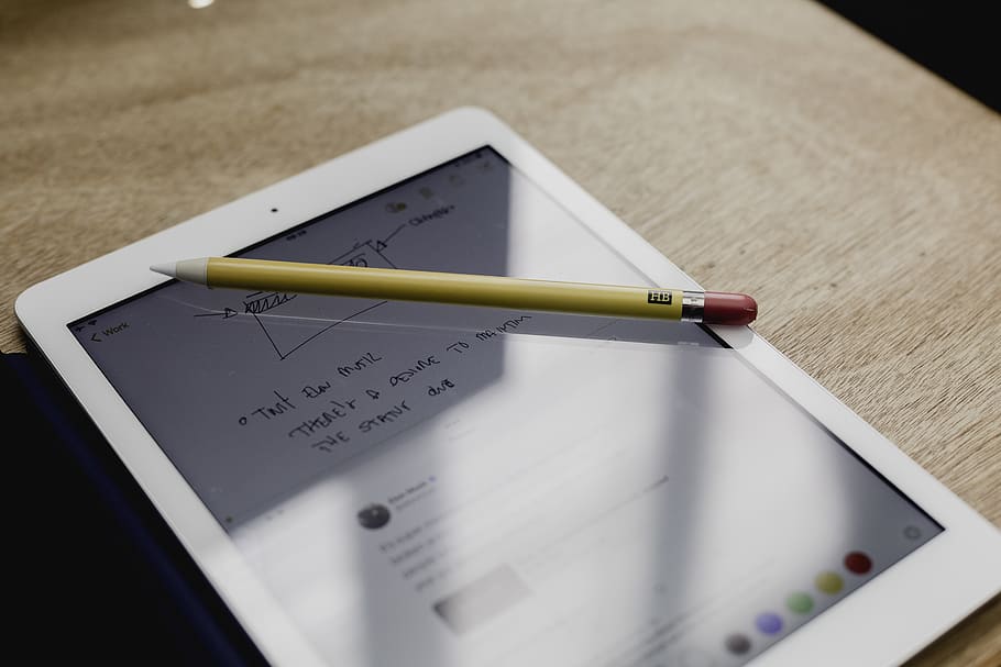 smart pen on turned-on tablet, still life, text, high angle view HD wallpaper
