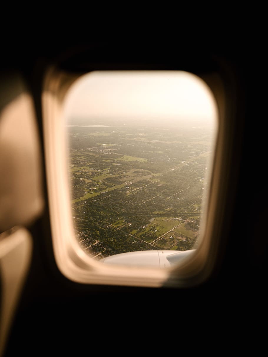 rectangular airplane window, landscape, looking through, glass