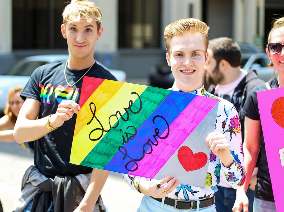 Three Men Holding Assorted Painted Love Is Love Banner, bright HD wallpaper