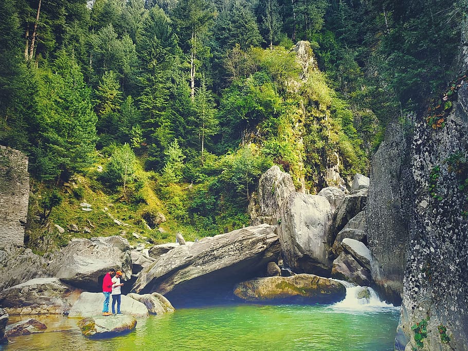 Men Standing on Rock Beside Green River, daytime, environment HD wallpaper