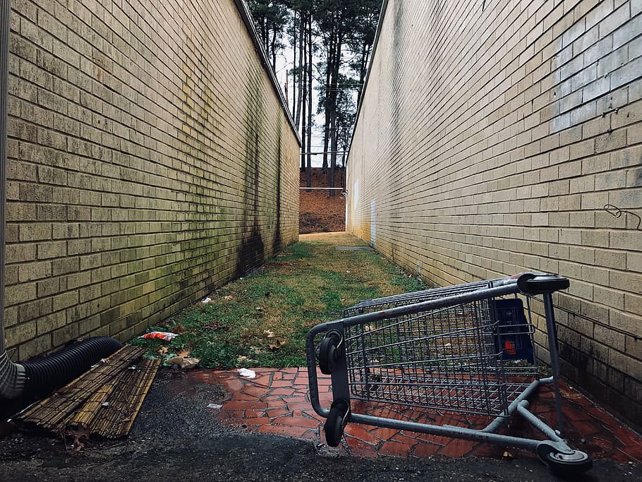 gray shopping cart, bench, alley, brick, alleyway, abandoned