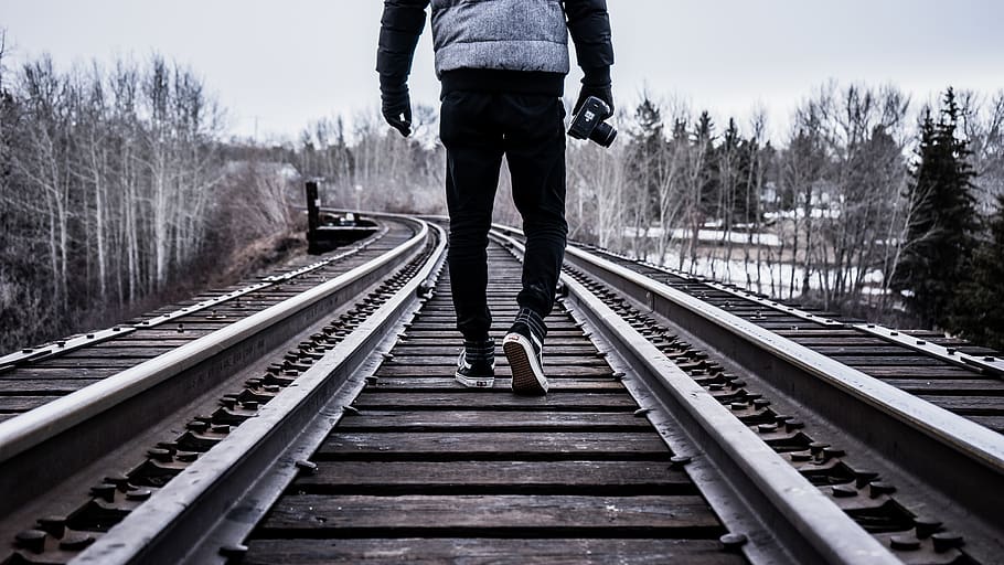 man waking on train rail, one person, railroad track, the way forward HD wallpaper