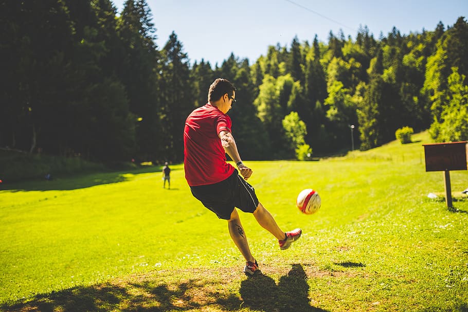 guy, man, male, play, football, soccer, kick, park, grass, signage HD wallpaper