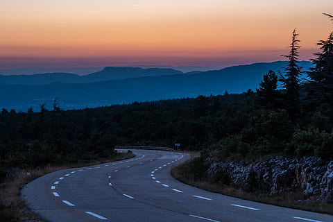 gray concrete road surrounded with trees during golden hour, france HD wallpaper