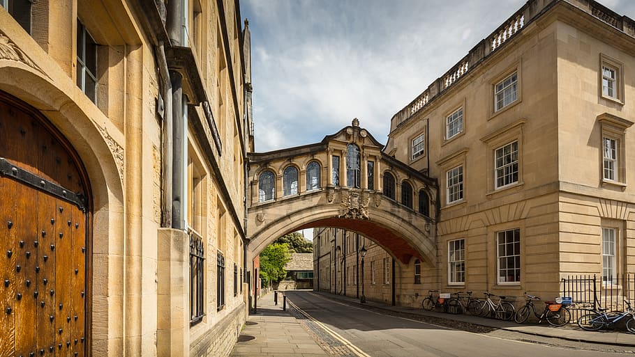 beige concrete village under blue sky, bridge of sighs, oxford