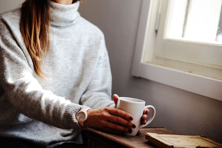 Woman Holding Coffee Mug While Sitting Beside Window, beverage HD wallpaper