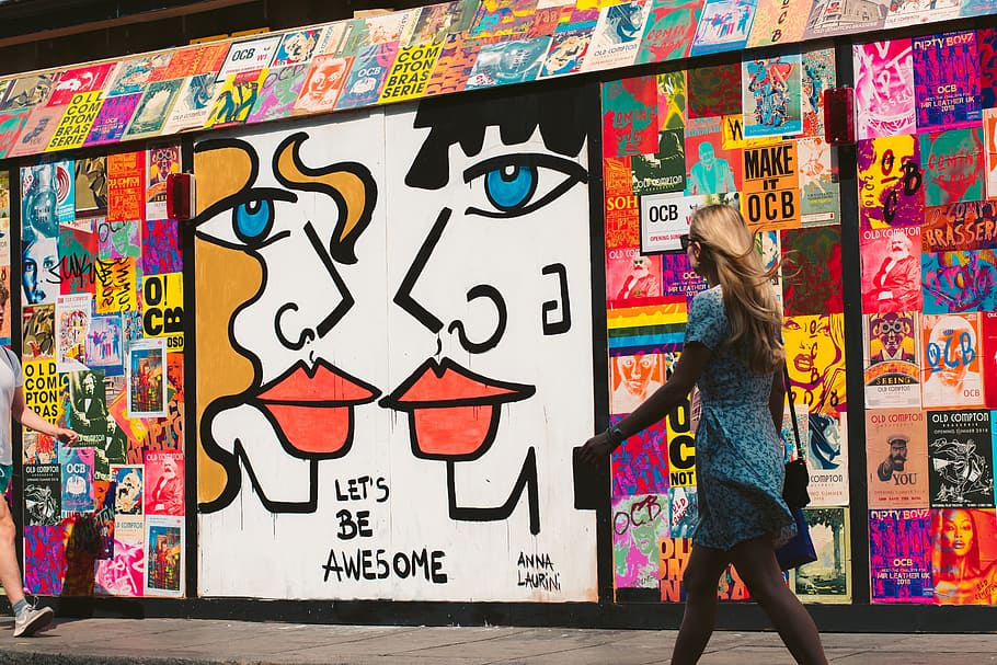 woman walking passes graffiti, person, street, wall, art, poster