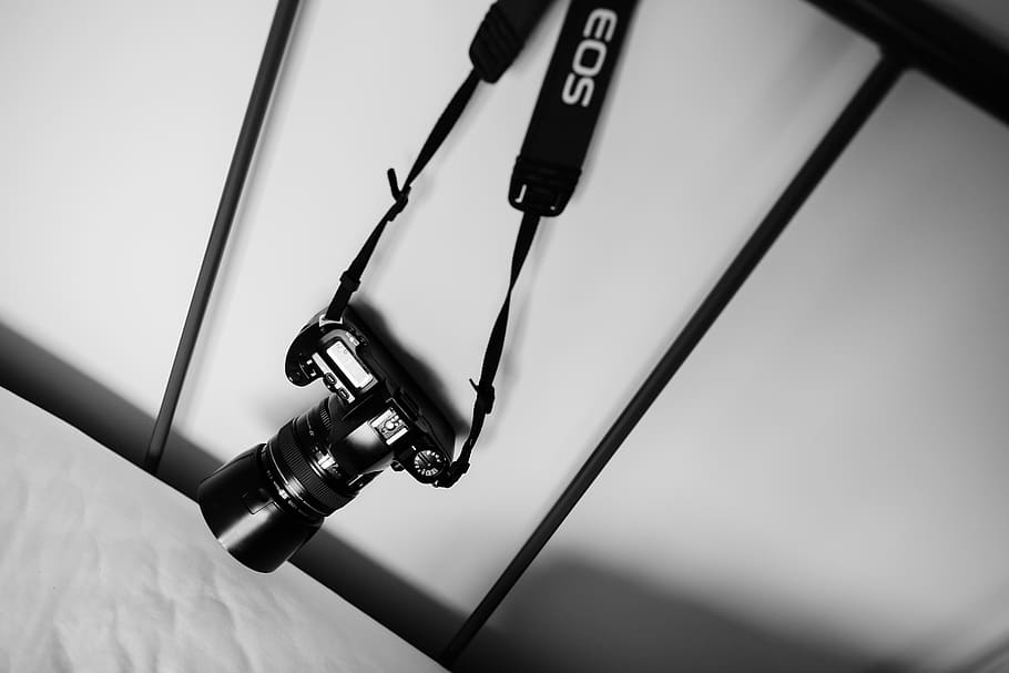 camera, no people, close-up, focus on foreground, indoors, hanging HD wallpaper