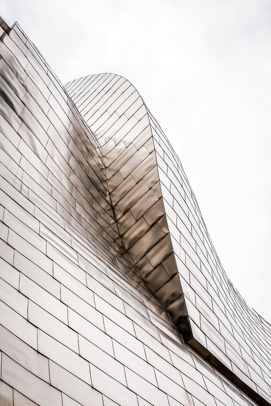 curved-top glass building under white sky, urban, skyscraper HD wallpaper