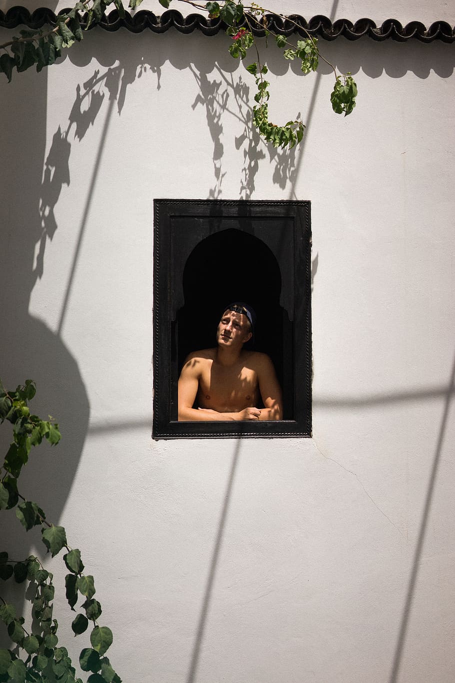 man in window, person, human, home decor, plant, morrocco, wall HD wallpaper