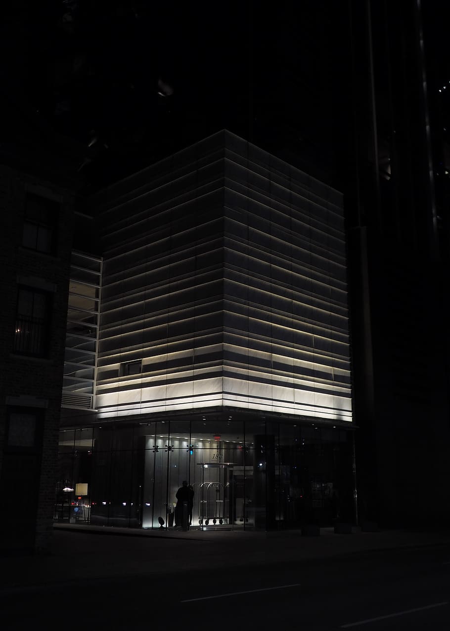 person standing under building at night, office building, human HD wallpaper