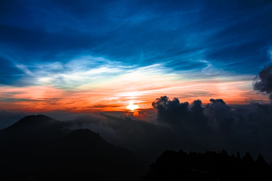 aerial-photography-of-mountain-and-trees-during-golden-hour.jpg