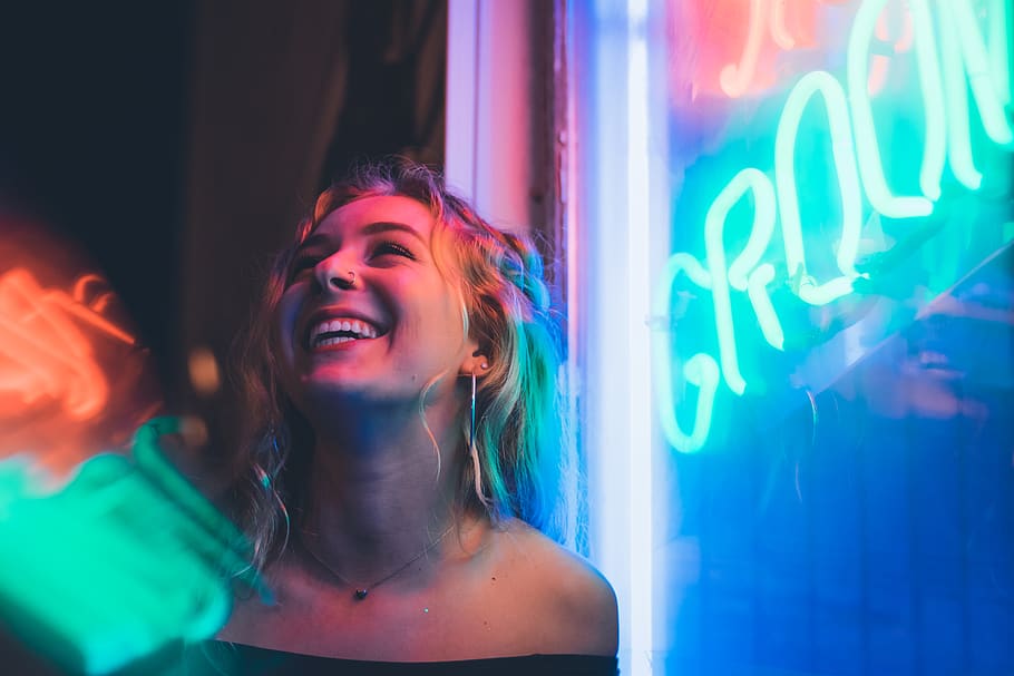 Woman Smiling Near Glass Window, girl, lights, neon sign, nightlife, HD wallpaper