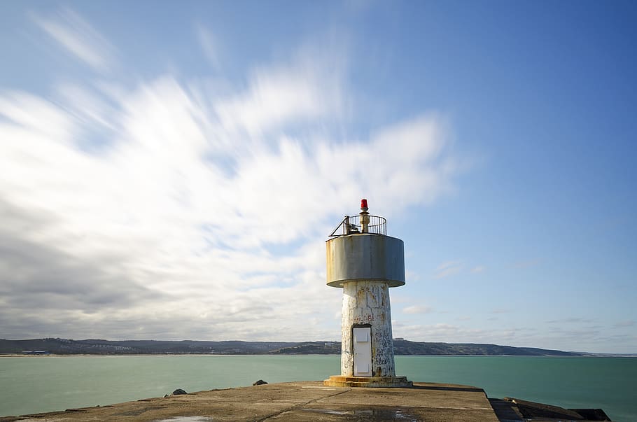 lighthouse, beacon, ocean, sea, water, tower, guide, sky, guidance HD wallpaper