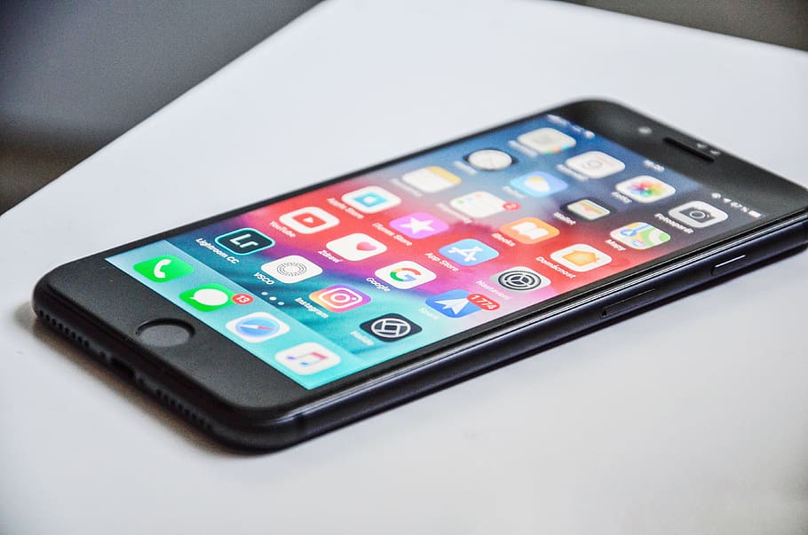 black iPhone 7 on white surface, technology, number, close-up HD wallpaper