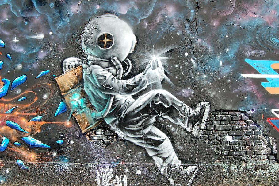 Graffiti art of an astronaut traveling through a colorful galaxy.
