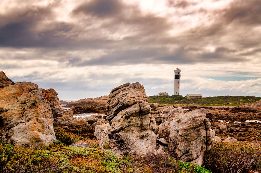 rocks, lighthouse, sky, clouds, landscape, beach, nature, coast HD wallpaper