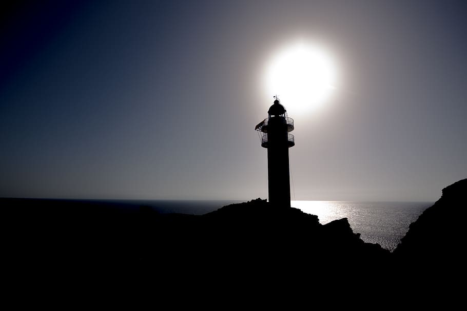 lighthouse, sunset, sea, sky, silhouette, water, tower, nature HD wallpaper