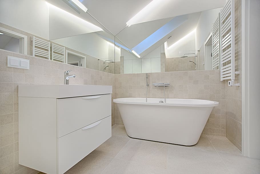 White Bathtub in Bathroom, cabinet, contemporary, faucet, floor